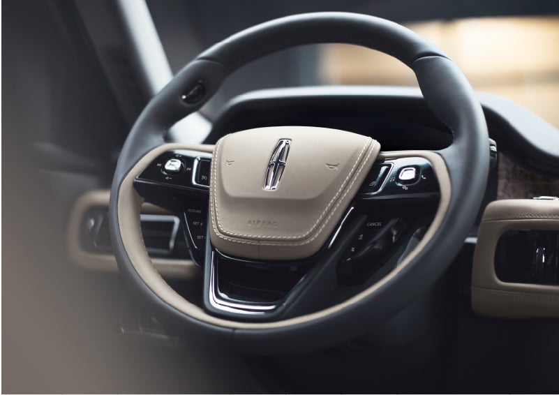 The intuitively placed controls of the steering wheel on a 2023 Lincoln Aviator® SUV | Green Lincoln in Greensboro NC