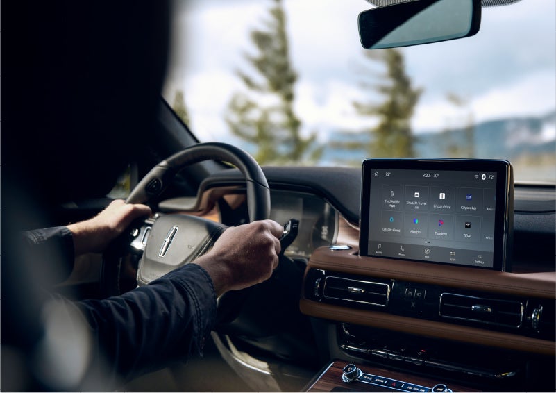The Lincoln+Alexa app screen is displayed in the center screen of a 2023 Lincoln Aviator® Grand Touring SUV | Green Lincoln in Greensboro NC