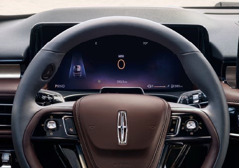 The driver’s information cluster display behind the steering wheel is shown. | Green Lincoln in Greensboro NC