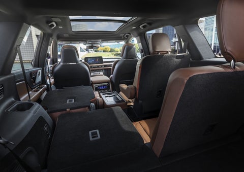 One side of the PowerFold® third-row seat and a second-row seat are folded forward in the 2026 Lincoln Aviator® SUV. | Green Lincoln in Greensboro NC