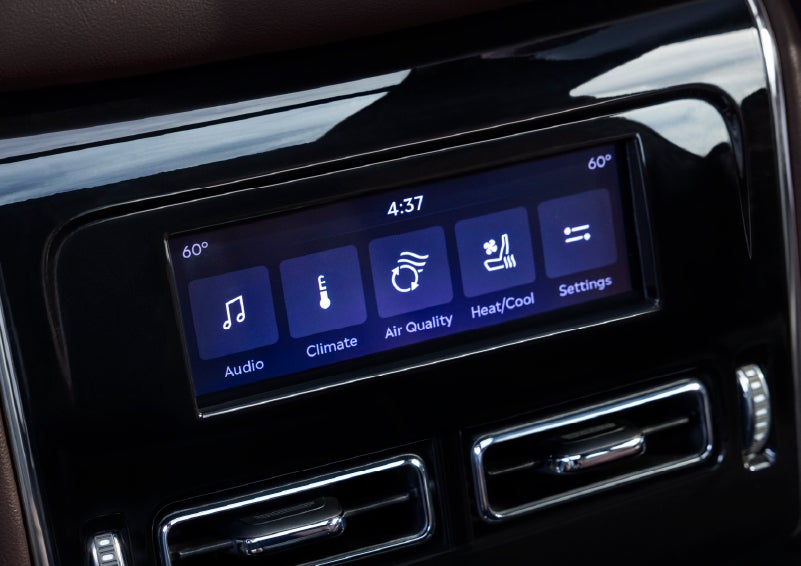 Driver controls like music, temperature, air quality, settings, and heat/cool seats are shown. | Green Lincoln in Greensboro NC