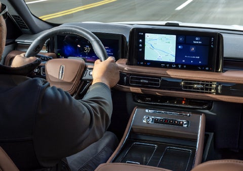 A person is driving a 2026 Lincoln Aviator® SUV as seen from inside the cabin. | Green Lincoln in Greensboro NC