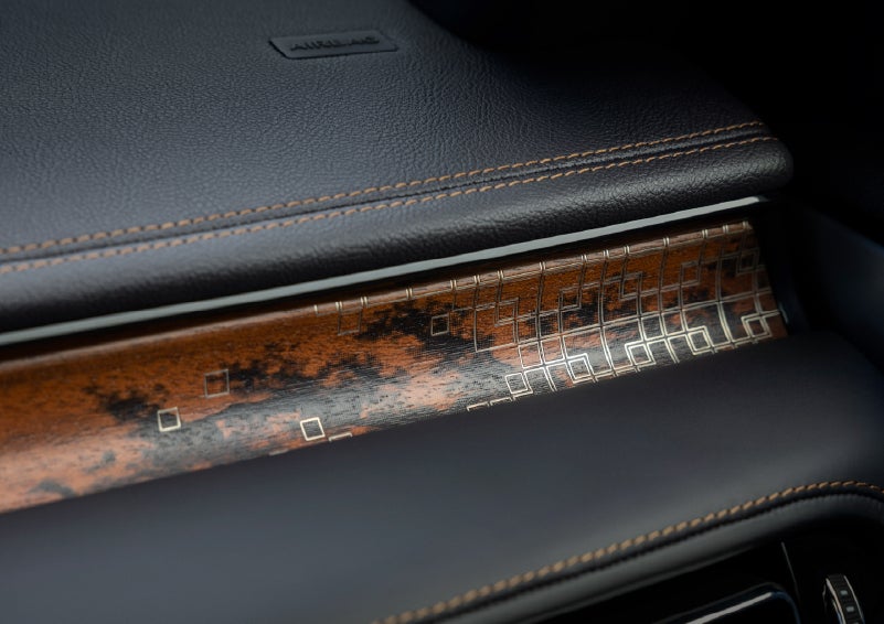 A close-up shot of the 2026 Lincoln Aviator® dashboard with unique black and brown accents and brown stitching. | Green Lincoln in Greensboro NC