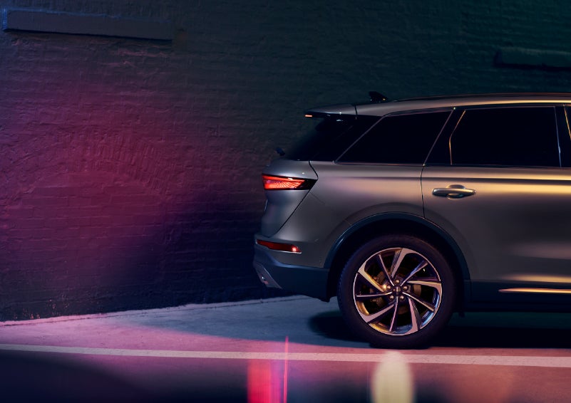 A dramatization of a 2026 Lincoln Corsair® SUV backing up toward a wall is shown. | Green Lincoln in Greensboro NC
