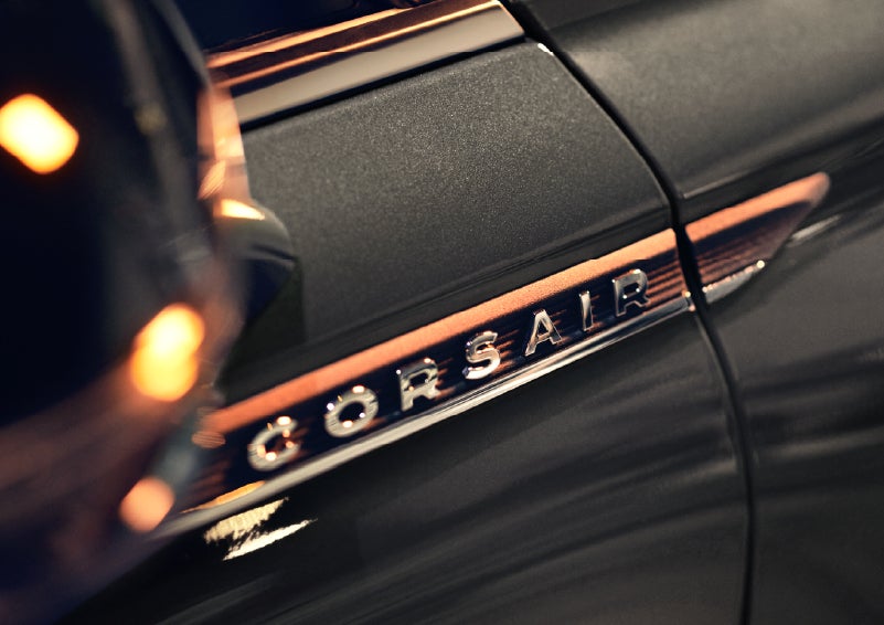 A 2026 Lincoln Corsair® SUV is shown being driven on a country road. | Green Lincoln in Greensboro NC