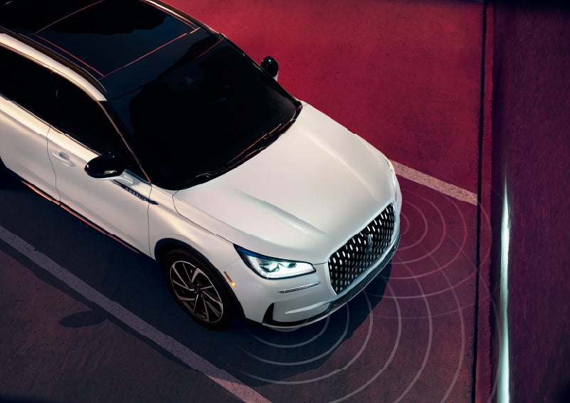 Simulated radar signals are shown emitting from the front of a 2026 Lincoln Corsair® SUV. | Green Lincoln in Greensboro NC