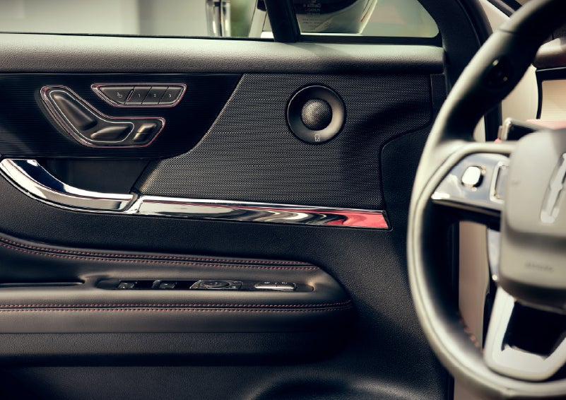 An audio speaker is shown in the driver's side door of a 2026 Lincoln Corsair® SUV | Green Lincoln in Greensboro NC