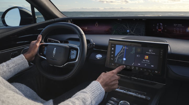 The driver of a 2026 Lincoln Nautilus® SUV interacts with the new Lincoln Digital Experience. | Green Lincoln in Greensboro NC