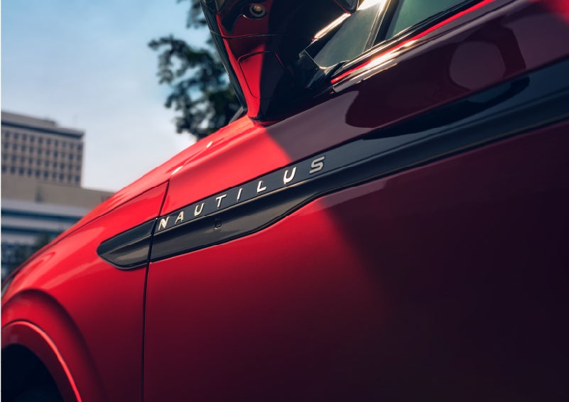 A side badge on the passenger door reads Nautilus. | Green Lincoln in Greensboro NC