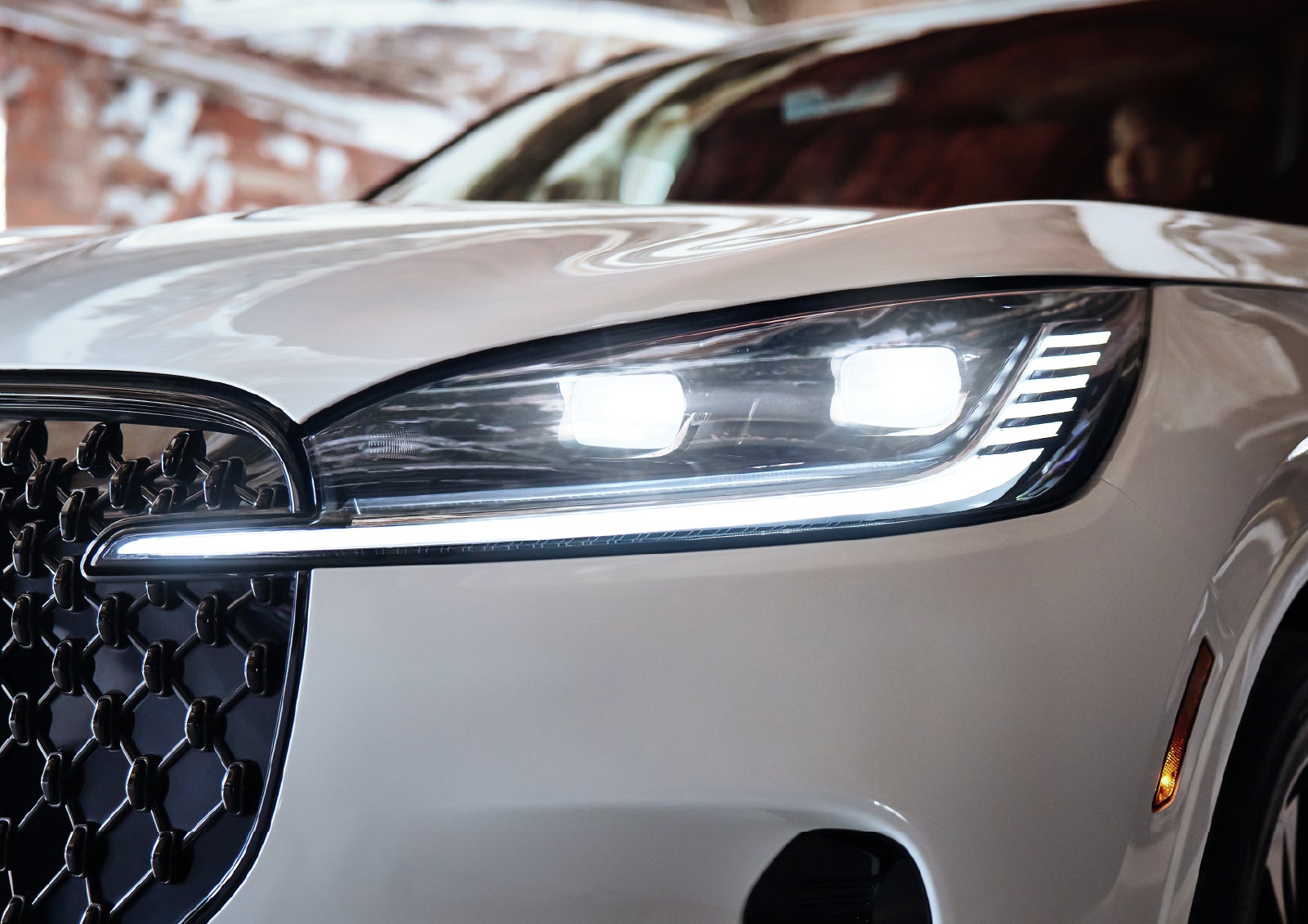 A close-up of a headlamp on the 2027 Lincoln Aviator® SUV is shown. | Green Lincoln in Greensboro NC