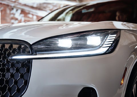 A close-up of a headlamp on the 2027 Lincoln Aviator® SUV is shown. | Green Lincoln in Greensboro NC