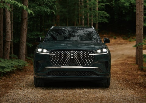 The front grille of a 2027 Lincoln Aviator® Black Label™ SUV is shown. | Green Lincoln in Greensboro NC