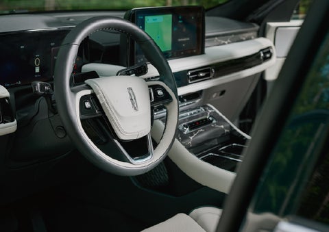 The leather-trimmed steering wheel of a 2027 Lincoln Aviator® Black Label™ SUV. | Green Lincoln in Greensboro NC